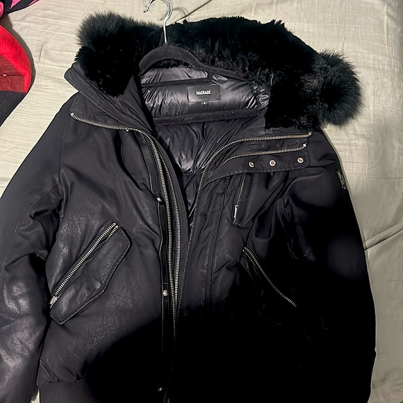 i’m selling my mackage black jacket it has multiple zippers size small unisex